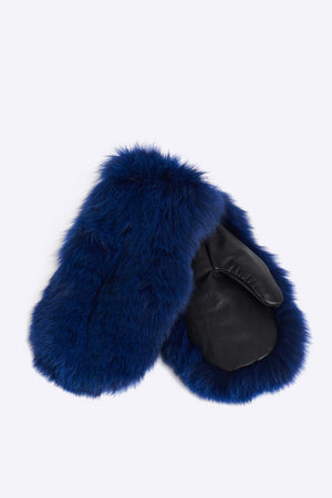 Upcycled fox fur winter mittens with a polyester lining. Will keep your hands warm in the coldest winter conditions. Has a leather trim and is cut, dyed and stitched by hand. Hand made in Montreal.